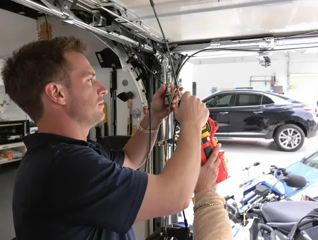 Windsor Garage Door Repair safety certified technician performing cable replacement in Windsor