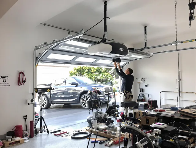 Windsor Garage Door Repair specialist installing smart garage door opener system in Windsor home